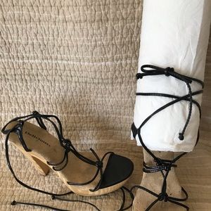 Strappy, chunky 5” heels, wood platforms.